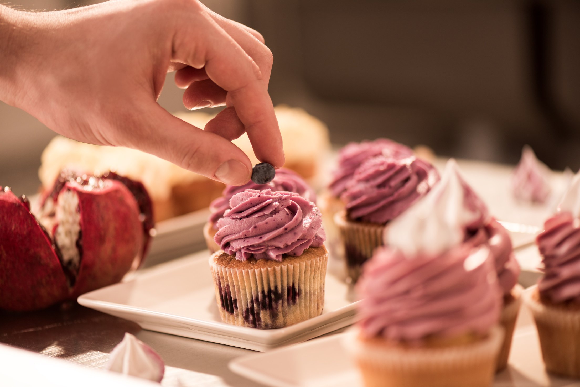 cropped shot confectioner decorating sweet