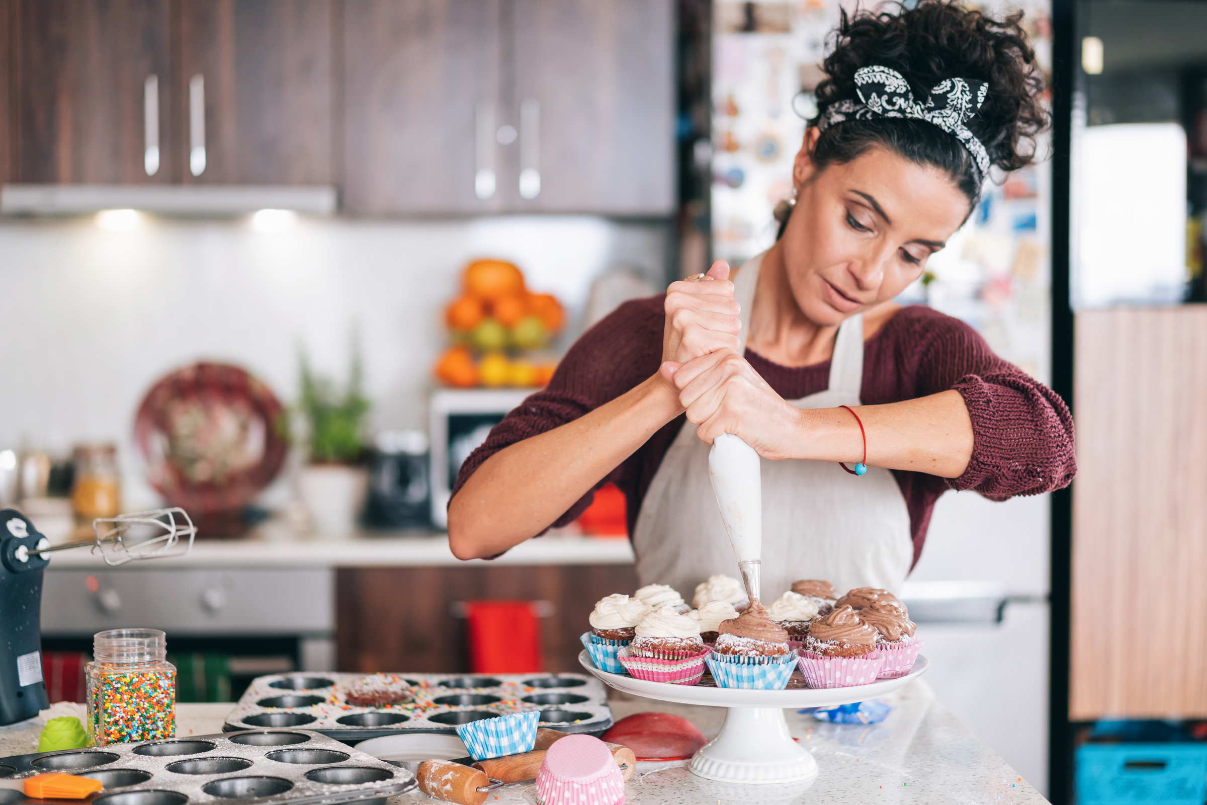 Confectioner decorating Chocolate Muffins